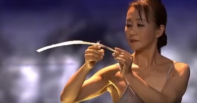 She Balances A Feather On Her Finger, But What Follows Leaves Everyone Speechless