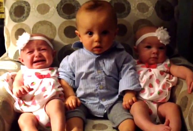 Little Boy Is Placed Between Twin Sisters. What He Does Next Is Priceless.