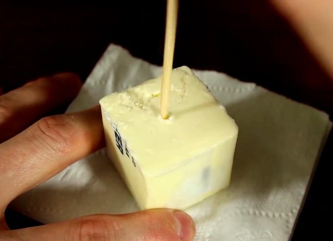 He Cuts A Stick Of Butter And Pokes A Hole In It For This Emergency DIY Hack