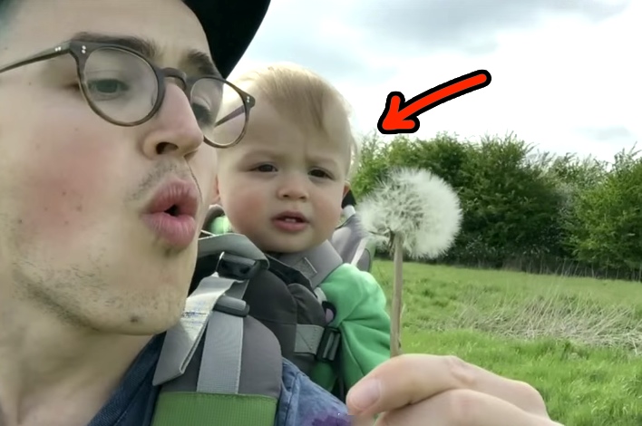 Dad Blows On A Dandelion, But Keep Your Eye On The Kid. Absolutely Adorable!