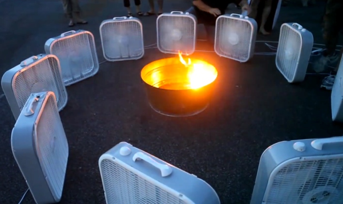 He Surrounds A Fire Pit With Fans. When He Turns Them On, This Happens.