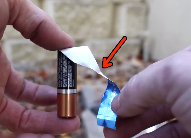 He Puts A Gum Wrapper At Both Ends Of A Battery. Seconds Later? Genius!