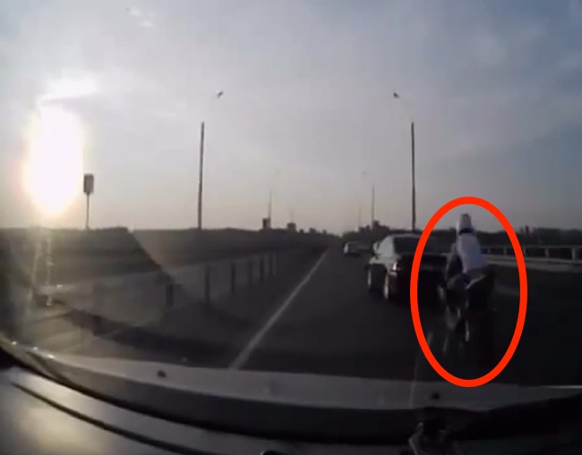 Biker Crashes Into Car. How He Survives Is Like A Scene Straight From An Action Movie.