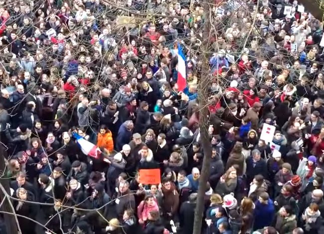 Man Plays This Song From Balcony During Paris Rally. Watch The Reaction.