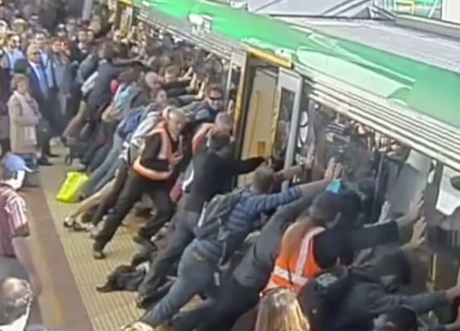 Man Gets Wedged At A Train Platform. Watch How He Escapes With Raw Power.