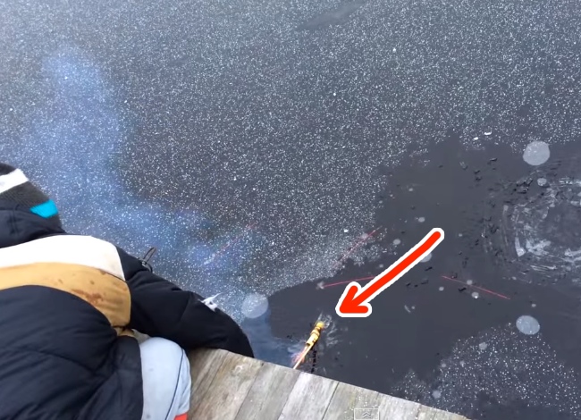 Guy Shoots Rocket Under The Ice Of A Frozen Lake, Is Shocked Senseless!