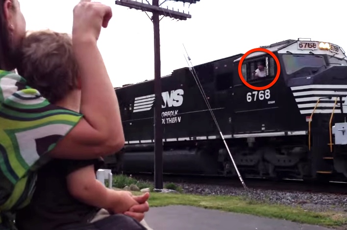 Boy Realizes Dad Is Driving Passing Train. His Reaction Is Priceless.