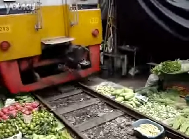 How Close To A Passing Train Can You Possibly Set Up A Vegetable Market?