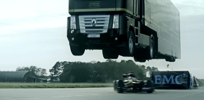 Giant Truck Makes A Record Breaking Jump Over A Speeding F1 Race Car