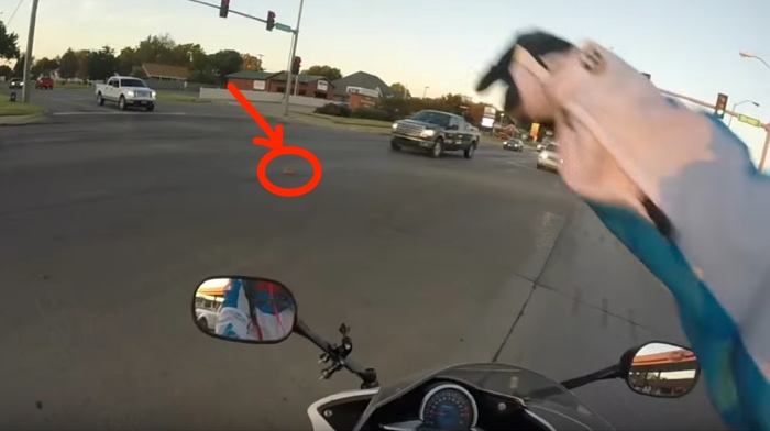 Motorcyclist Saves A Kitten From A Busy Intersection