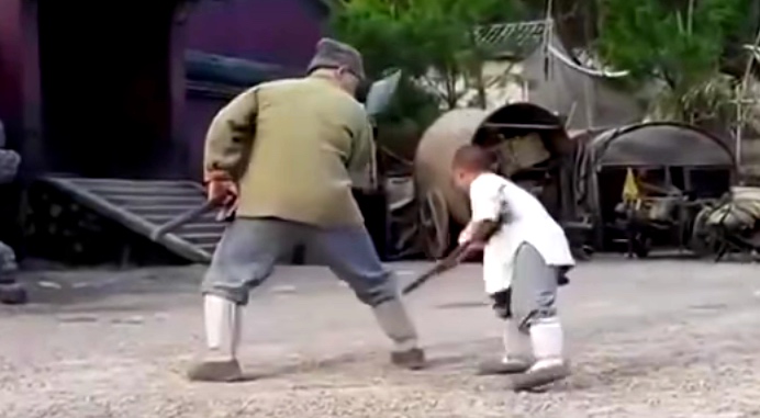 A Shaolin Kid Teaching Jackie Chan A Staff Routine