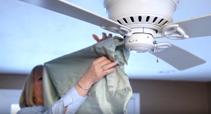 Using An Old Pillowcase, This Woman Has An Ingenious Way To Clean A Ceiling Fan In Seconds