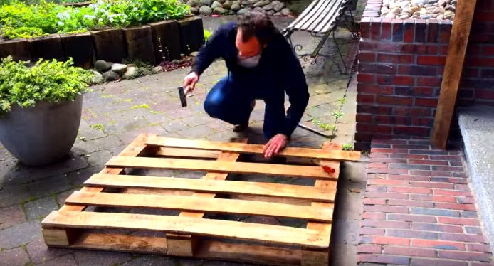 Father Makes A Moon-Shaped Crib Out Of Wood Pallets