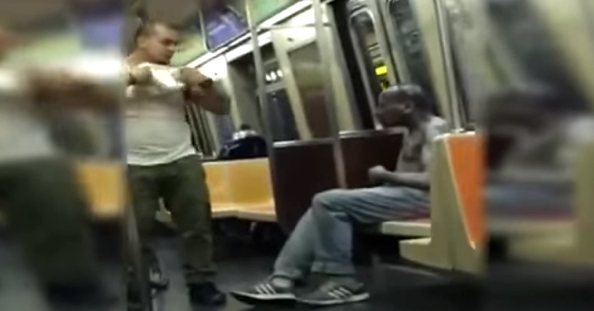Subway Rider Literally Gives A Homeless Man The Shirt Off His Back