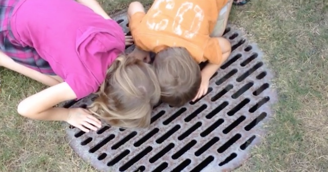 Father Rescues a Trapped Baby Turtle From a Storm Drain