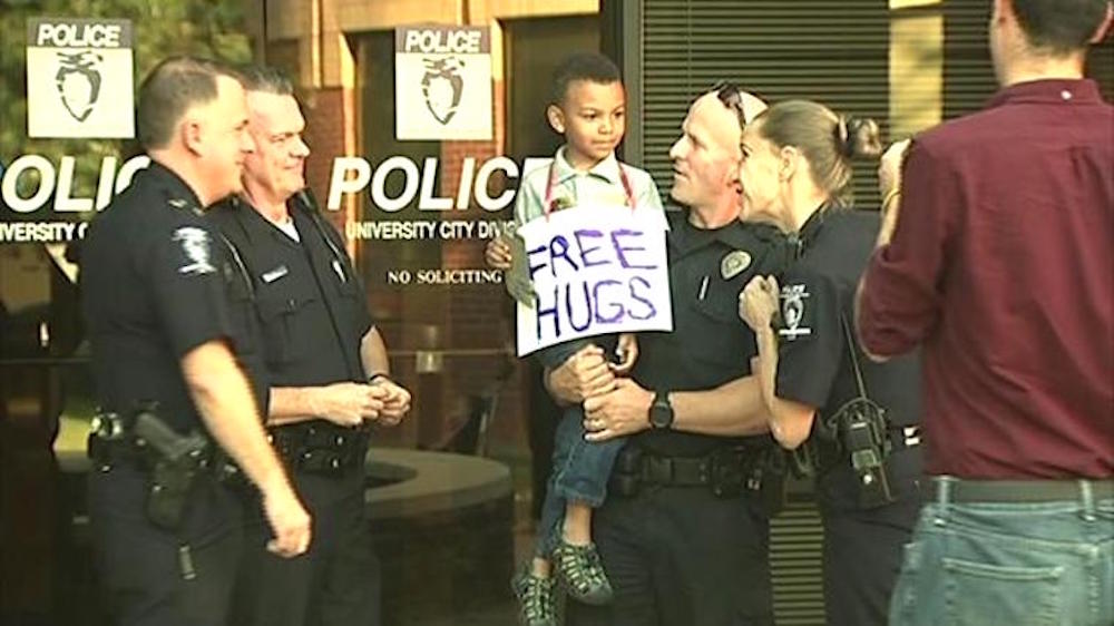 Little Boy Comes into Police Station With Sign, Shocks Entire Police Force